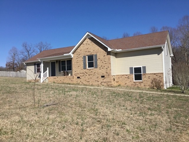 5975 Campbell Road Cross Plains, TN 37049 - Photo 1 of 26 a front view of a house with a yard