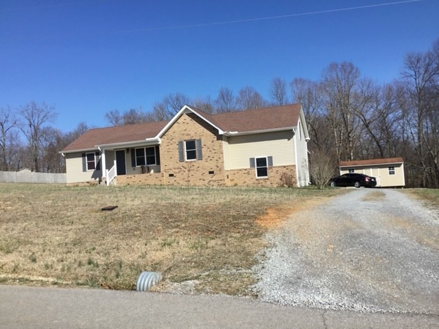 5975 Campbell Road Cross Plains, TN 37049 - Photo 2 of 26 a car parked in front of white house