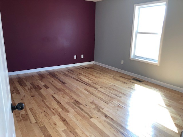 5975 Campbell Road Cross Plains, TN 37049 - Photo 12 of 26 an empty room with wooden floor and windows