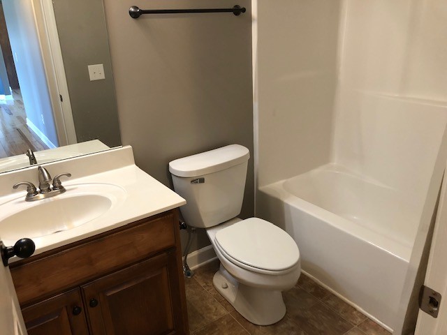 5975 Campbell Road Cross Plains, TN 37049 - Photo 18 of 26 a white toilet sitting next to a bathroom sink