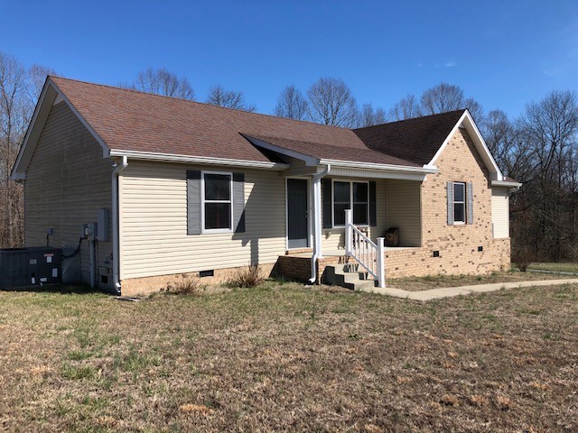 5975 Campbell Road Cross Plains, TN 37049 - Photo 21 of 26 a view of a house with backyard and porch
