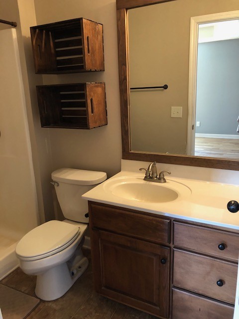 5975 Campbell Road Cross Plains, TN 37049 - Photo 24 of 26 a bathroom with a toilet a sink and mirror