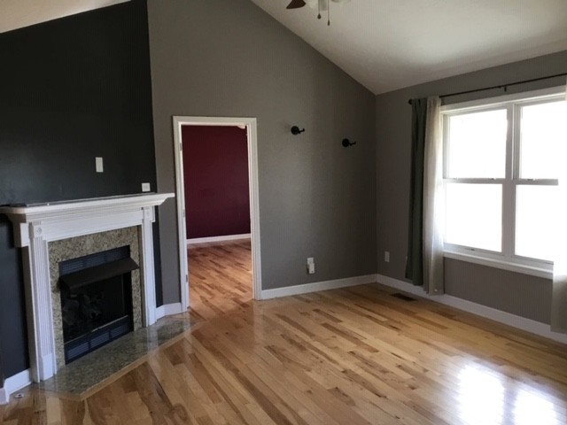 5975 Campbell Road Cross Plains, TN 37049 - Photo 5 of 26 a view of empty room with wooden floor and fireplace