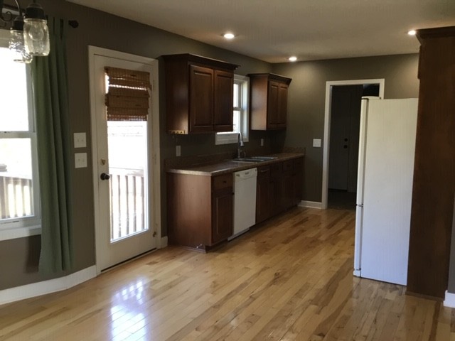 5975 Campbell Road Cross Plains, TN 37049 - Photo 6 of 26 a kitchen with stainless steel appliances granite countertop a refrigerator and a sink