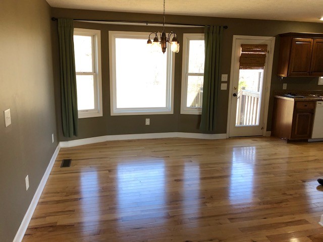 5975 Campbell Road Cross Plains, TN 37049 - Photo 9 of 26 a view of an empty room with wooden floor and a window