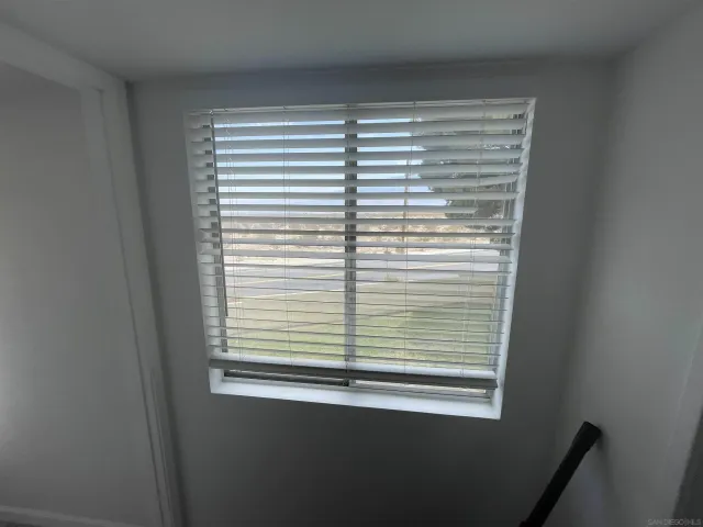 a view of a room that has a window in it