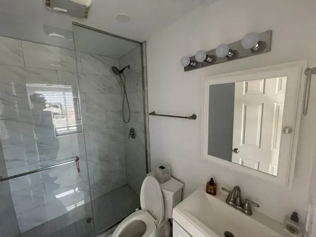 a bathroom with a sink and mirror