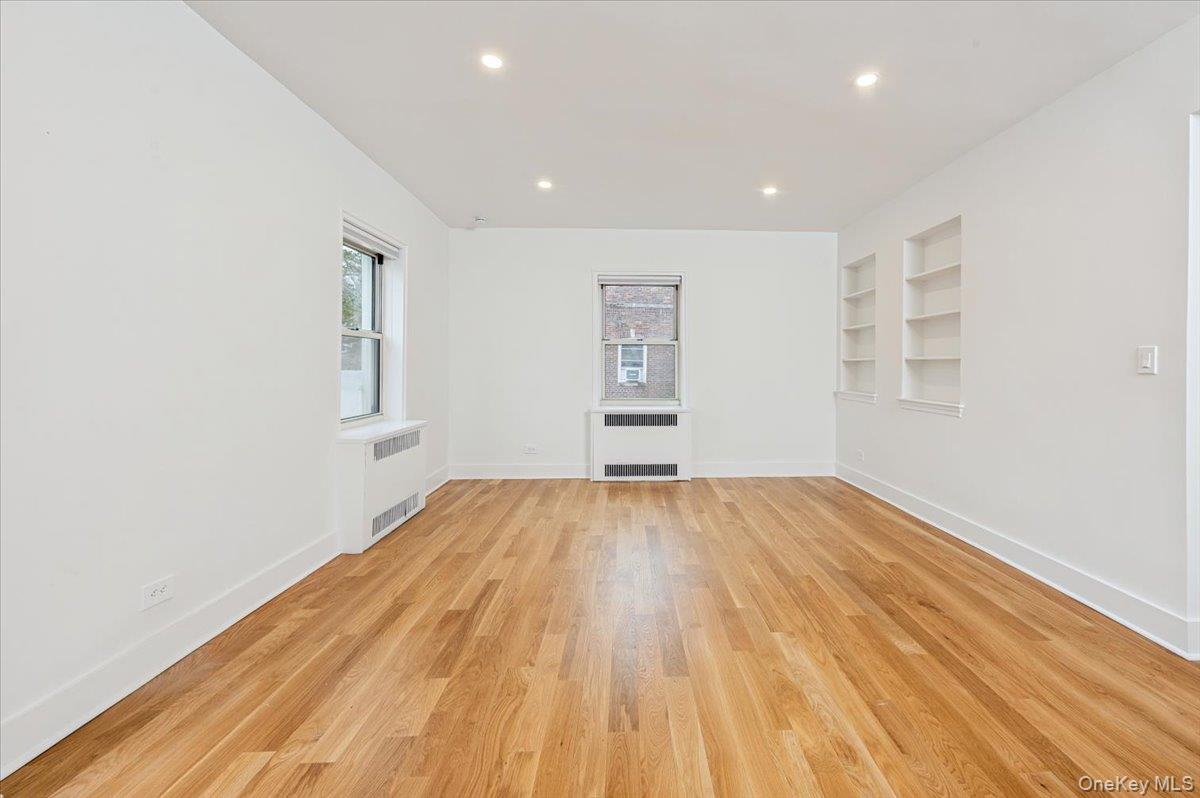 13 Sunnybrook Road, Unit 3D Bronxville, NY 10708 - Photo 1 of 17 a view of empty room with wooden floor and fan