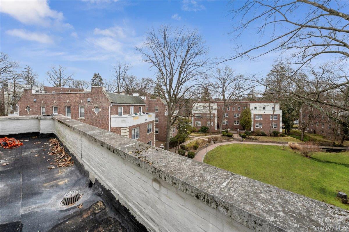 13 Sunnybrook Road, Unit 3D Bronxville, NY 10708 - Photo 13 of 17 a view of a house with a yard and sitting area