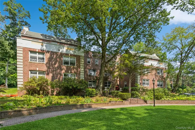 a view of a building with a yard