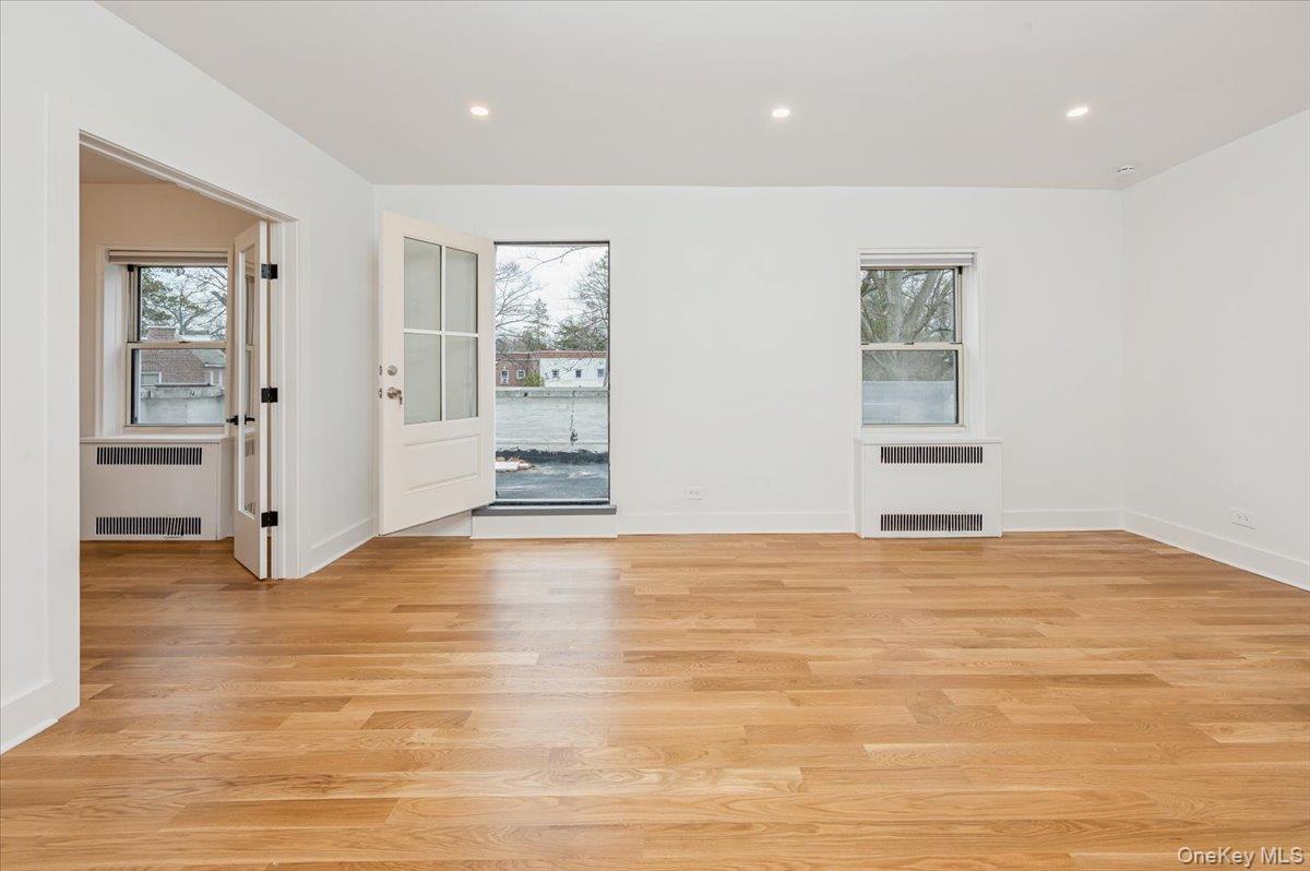 13 Sunnybrook Road, Unit 3D Bronxville, NY 10708 - Photo 2 of 17 a view of an empty room with wooden floor and a window