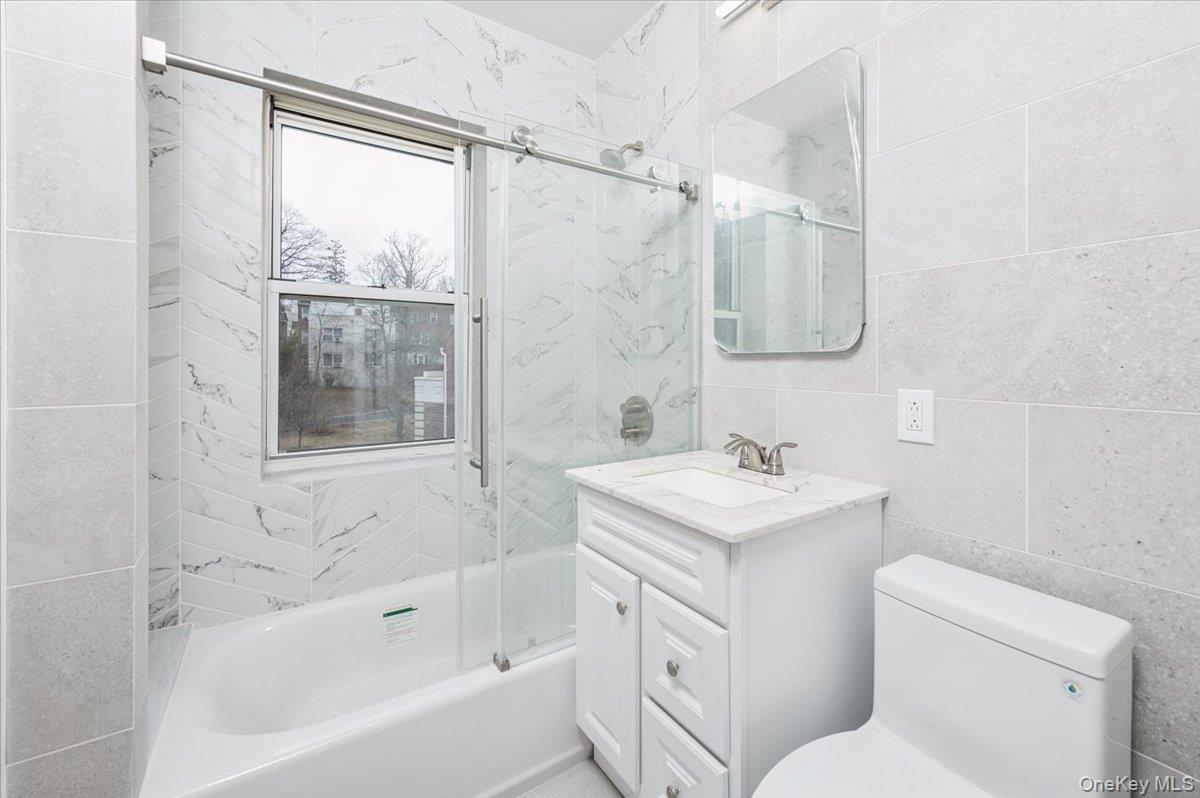 13 Sunnybrook Road, Unit 3D Bronxville, NY 10708 - Photo 8 of 17 a bathroom with a sink toilet vanity and shower