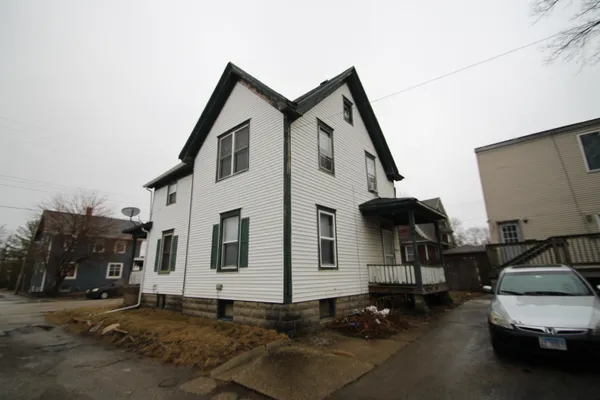 a front view of a house with parking