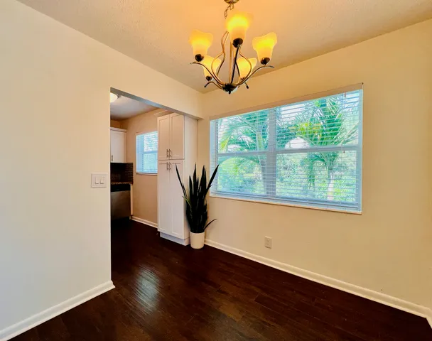 a view of a room with wooden floor and balcony
