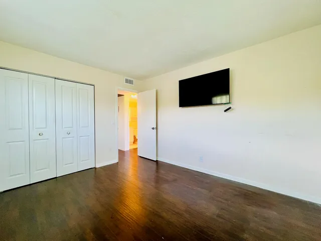 a view of a livingroom with wooden floor