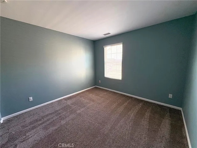 a view of a room with closet and wooden floor