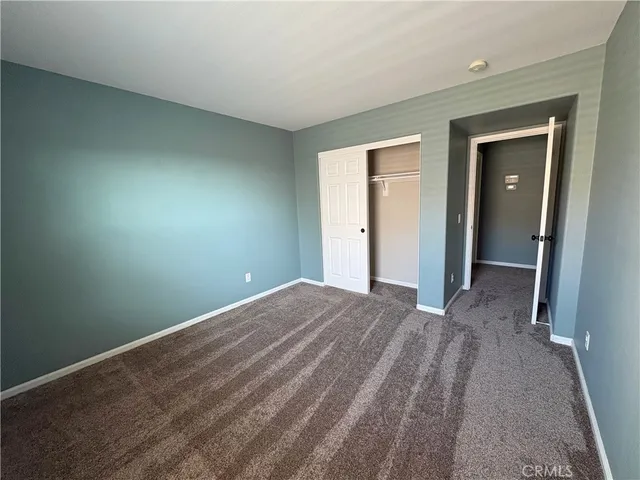a spacious bathroom with a double vanity sink toilet and a tub