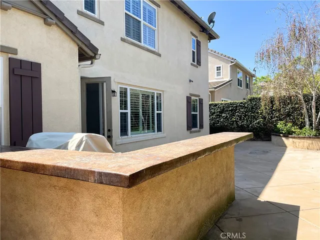 a view of a bench in a backyard