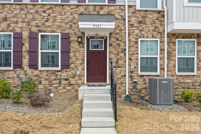 a kitchen with stainless steel appliances kitchen island a cabinets and wooden floor