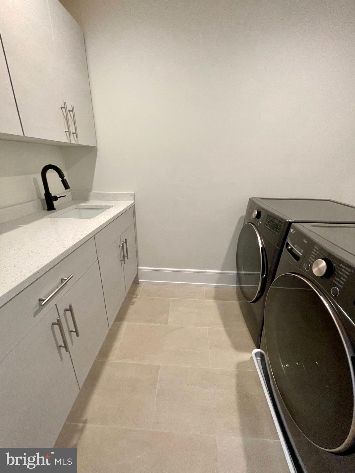 2011 Renaissance Walk, Unit 13 Philadelphia, PA 19145 - Photo 24 of 52 Large happy laundry room - ample cabinets