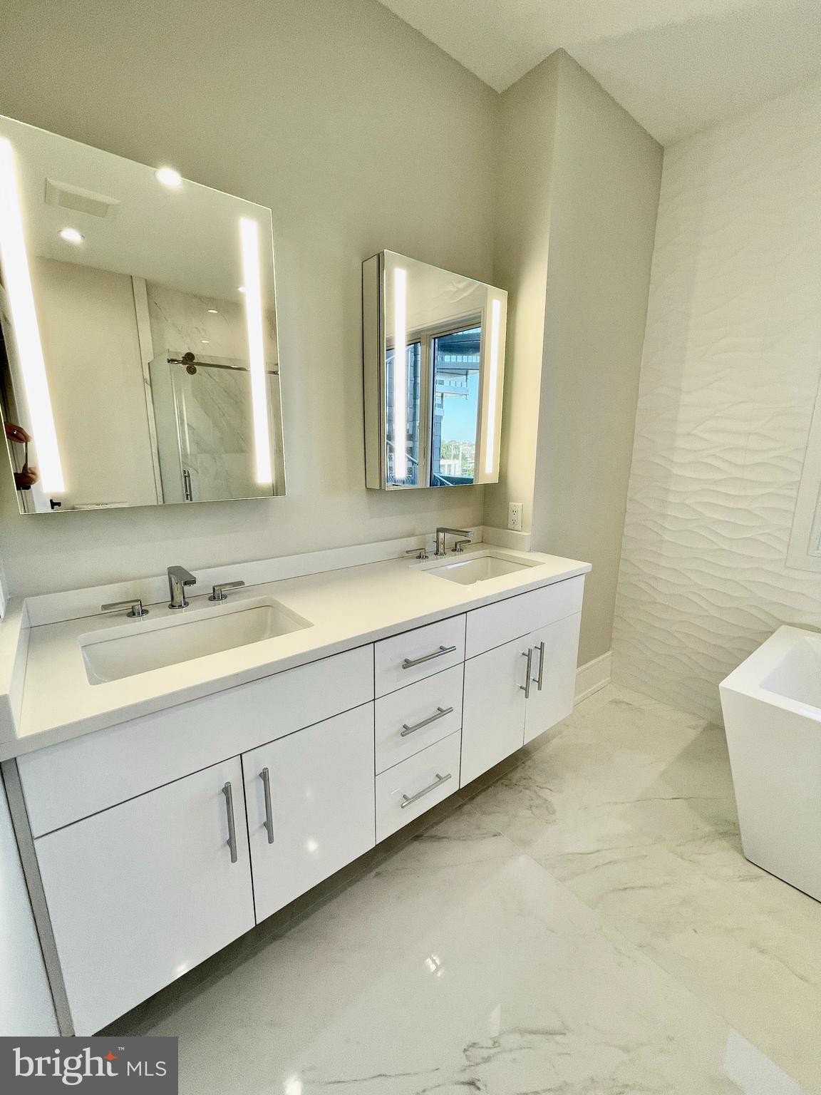 2011 Renaissance Walk, Unit 13 Philadelphia, PA 19145 - Photo 5 of 52 Primary bath - double vanity, lighted mirrors