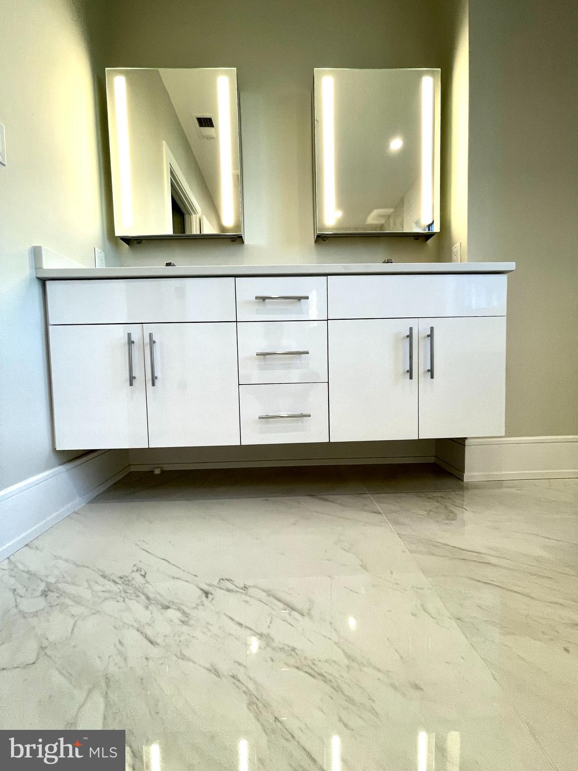 2011 Renaissance Walk, Unit 13 Philadelphia, PA 19145 - Photo 6 of 52 Primary bath - double vanity, lighted mirrors