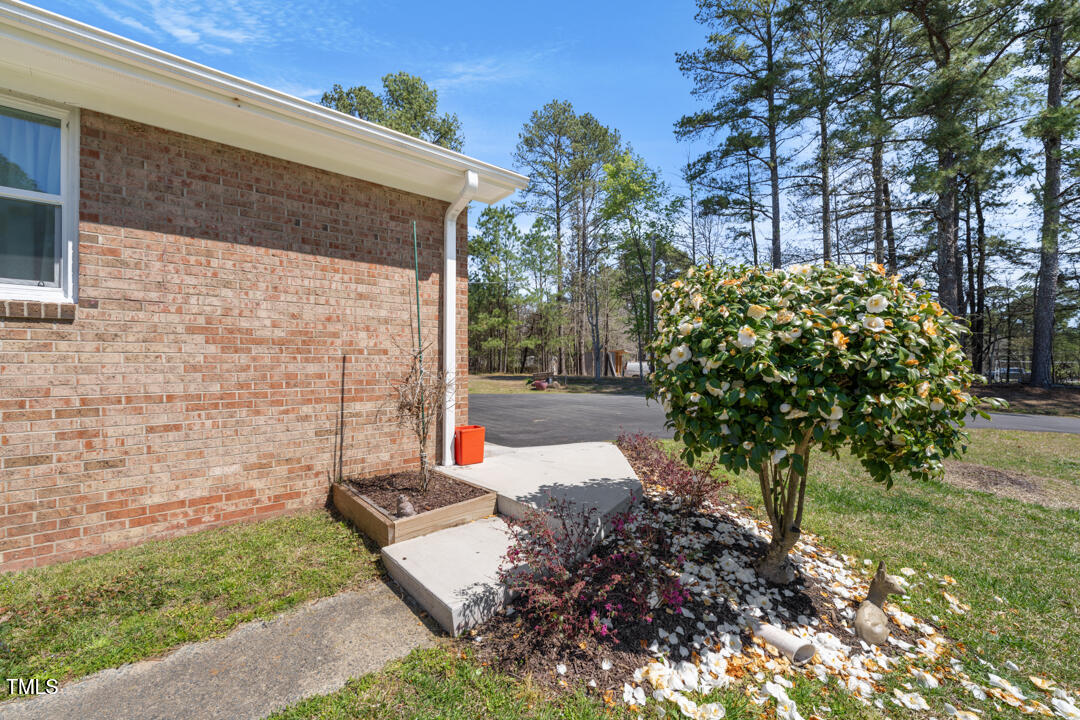 916 Clayton Road Durham, NC 27703 - Photo 22 of 32 a view of a yard with plants