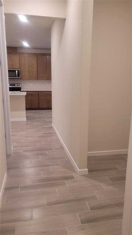 6558 Rover Way St. Cloud, FL 34771 - Photo 11 of 24 a view of kitchen and empty room
