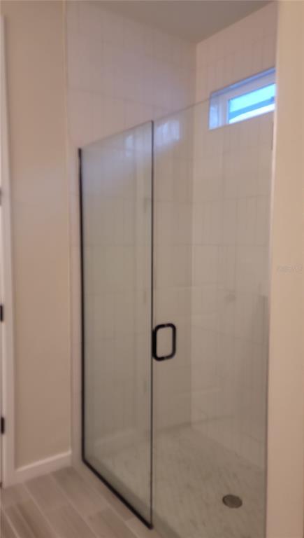 6558 Rover Way St. Cloud, FL 34771 - Photo 16 of 24 a bathroom with a shower