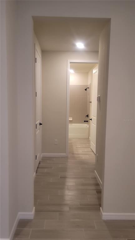 6558 Rover Way St. Cloud, FL 34771 - Photo 17 of 24 an empty room with mirror