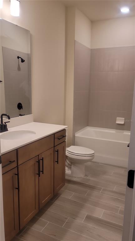 6558 Rover Way St. Cloud, FL 34771 - Photo 18 of 24 a bathroom with a sink a toilet and shower