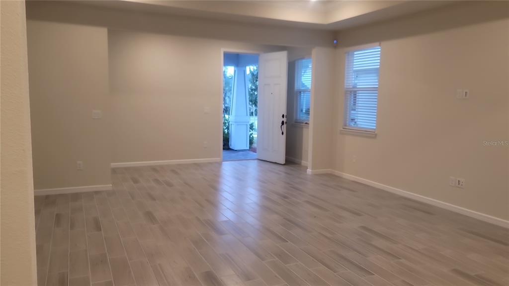 6558 Rover Way St. Cloud, FL 34771 - Photo 5 of 24 a view of a room with wooden floor and window