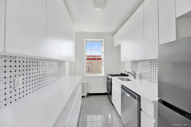 a kitchen with a stove and a white refrigerator