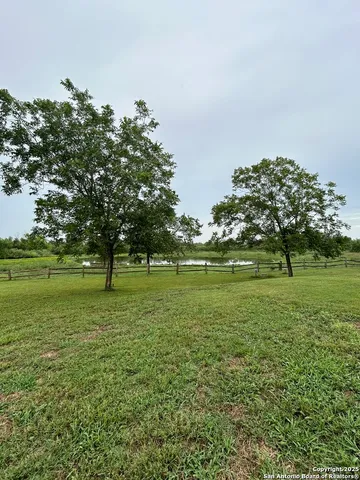 a view of a golf course with a lake
