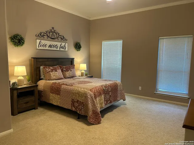 a bedroom with a bed and a cabinets