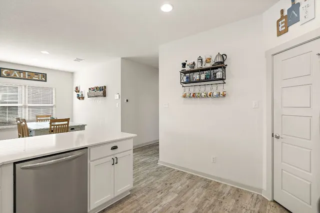 a room with a refrigerator and a sink