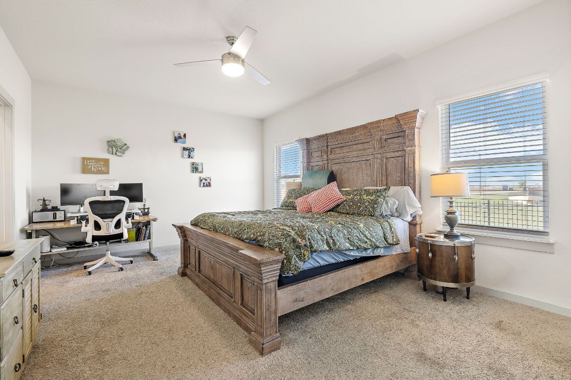 5001 Vanner Path Georgetown, TX 78626 - Photo 12 of 26 a bedroom with a bed and a window