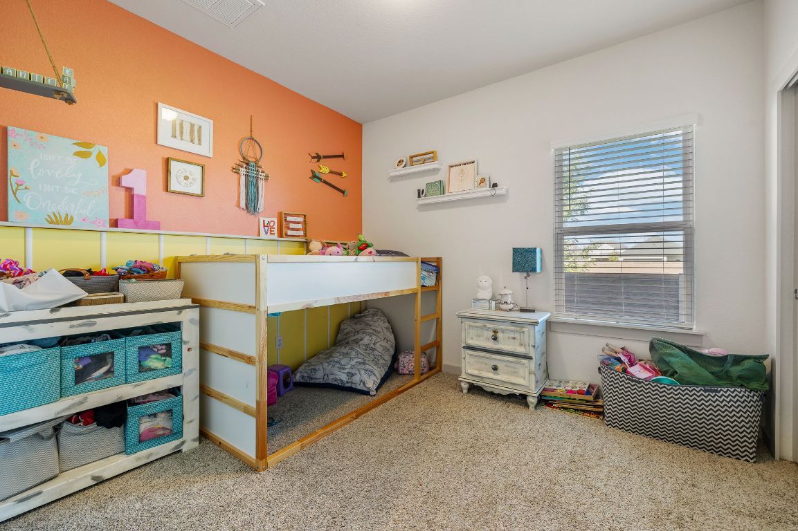 5001 Vanner Path Georgetown, TX 78626 - Photo 19 of 26 a bedroom with a bed and a window