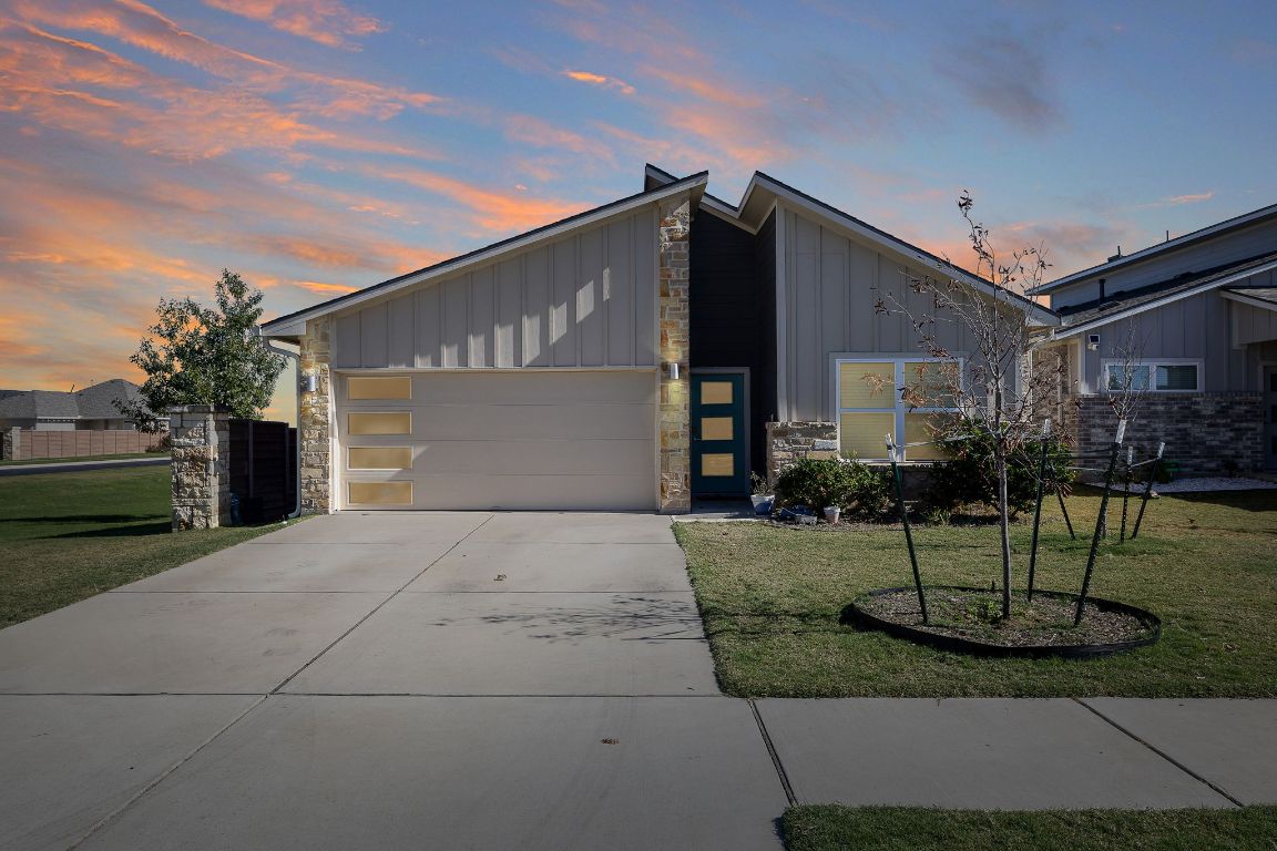 5001 Vanner Path Georgetown, TX 78626 - Photo 2 of 26 a front view of a house with garden