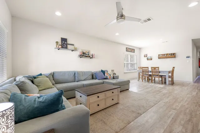 a living room with furniture and white walls