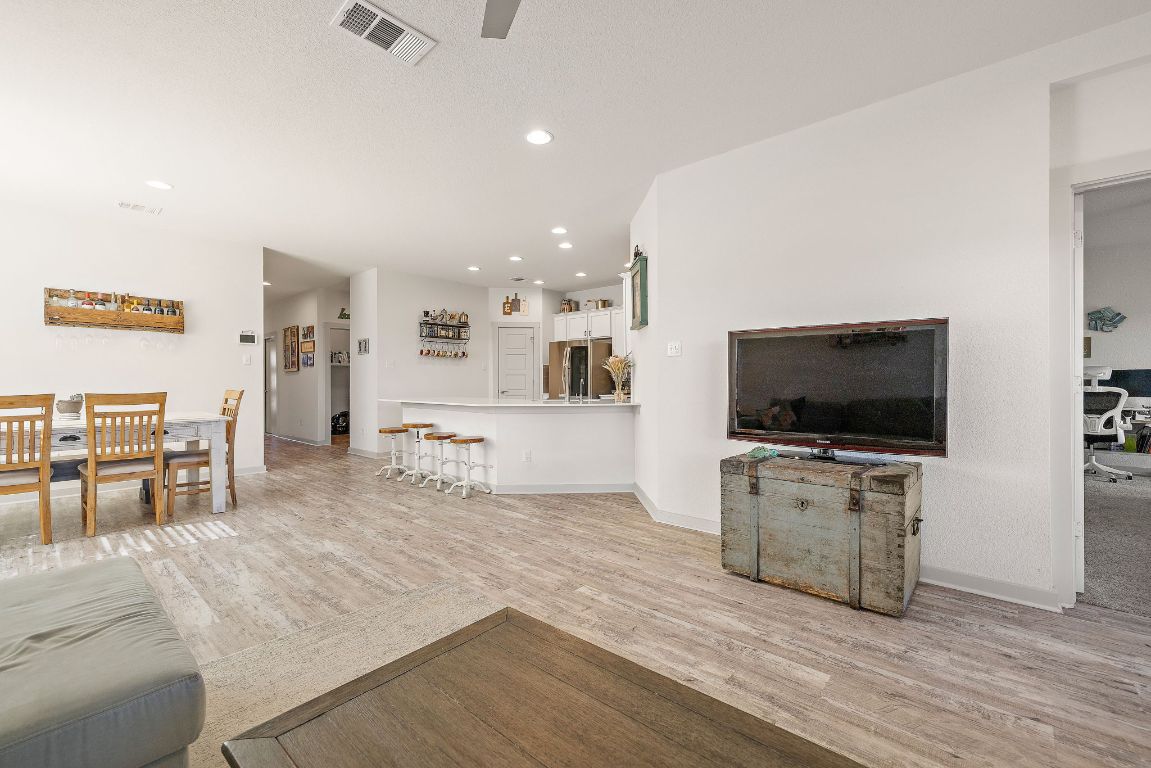 5001 Vanner Path Georgetown, TX 78626 - Photo 5 of 26 a living room with furniture and a flat screen tv