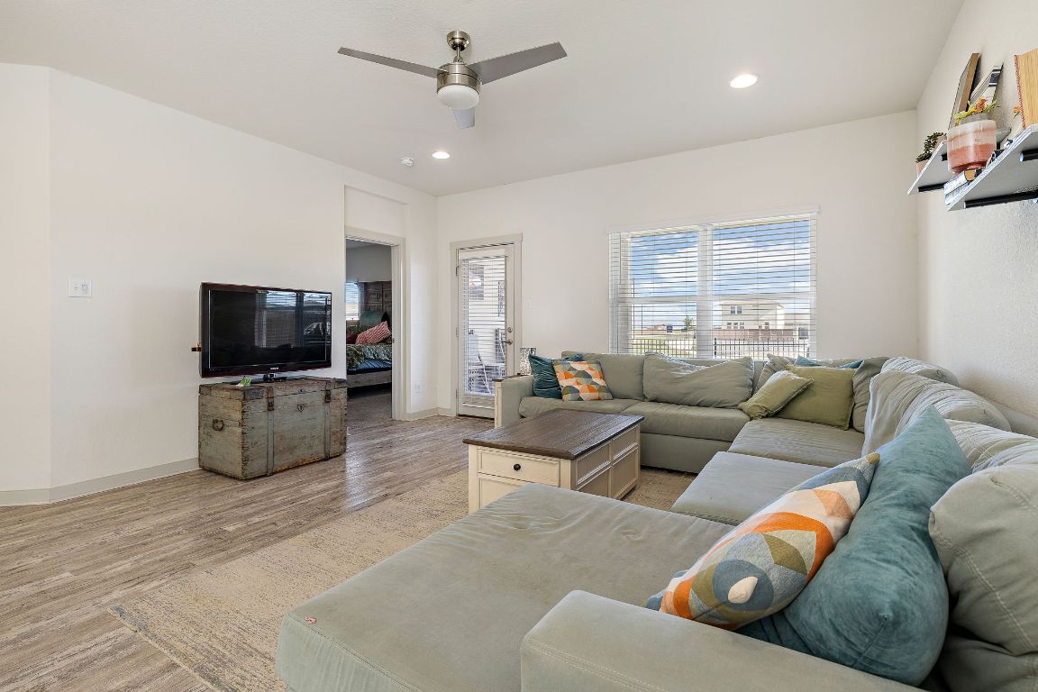 5001 Vanner Path Georgetown, TX 78626 - Photo 7 of 26 a living room with furniture and a flat screen tv