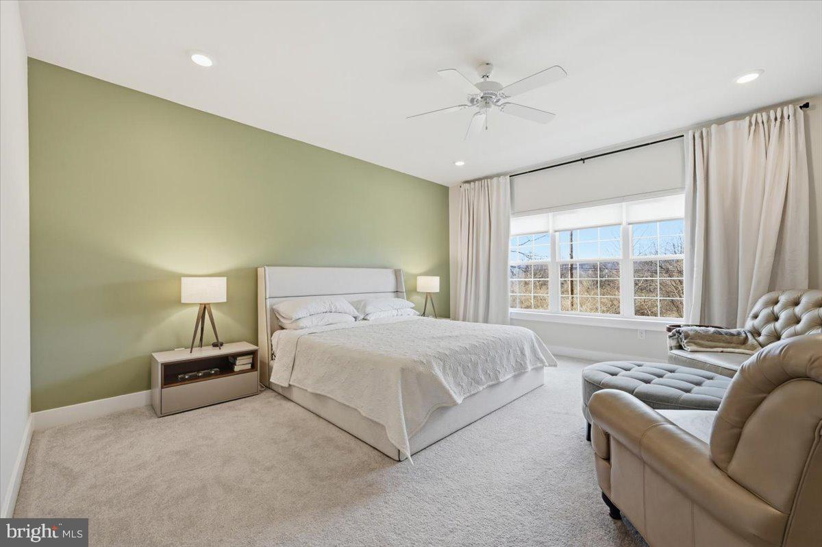 279 Red Leaf Lane Exton, PA 19341 - Photo 15 of 30 a bedroom with a large bed and ceiling fan