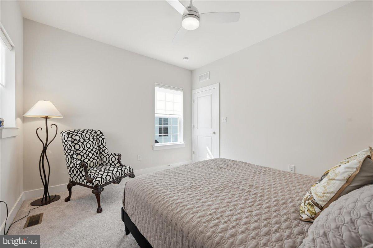 279 Red Leaf Lane Exton, PA 19341 - Photo 21 of 30 a bedroom with a bed lamps and a window