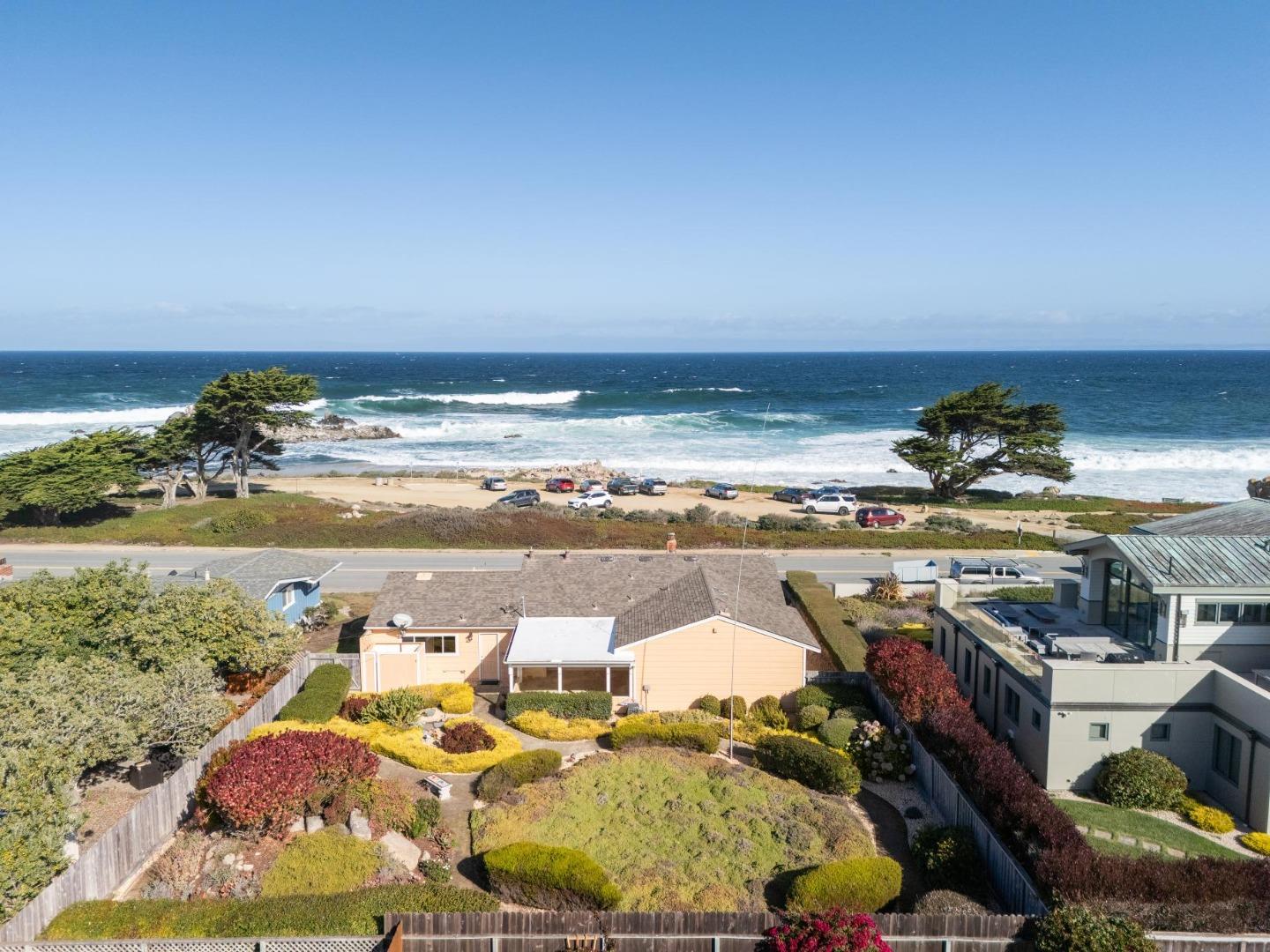 1261 Ocean View Boulevard Pacific Grove, CA 93950 - Photo 2 of 37 a view of a lake and a mountain