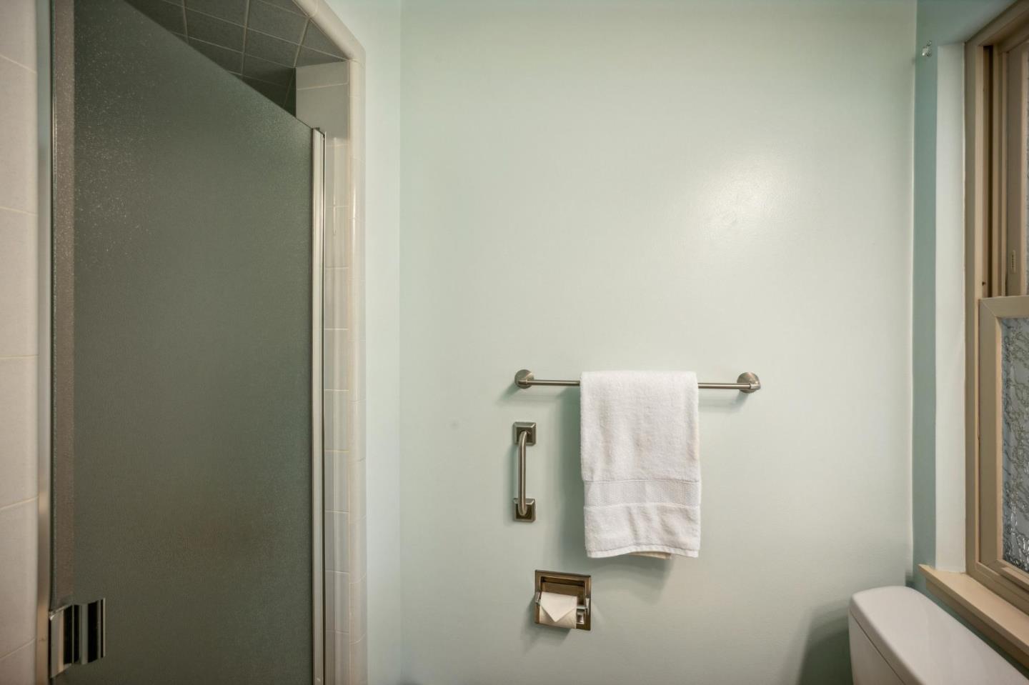 1261 Ocean View Boulevard Pacific Grove, CA 93950 - Photo 22 of 37 a bathroom with a shower