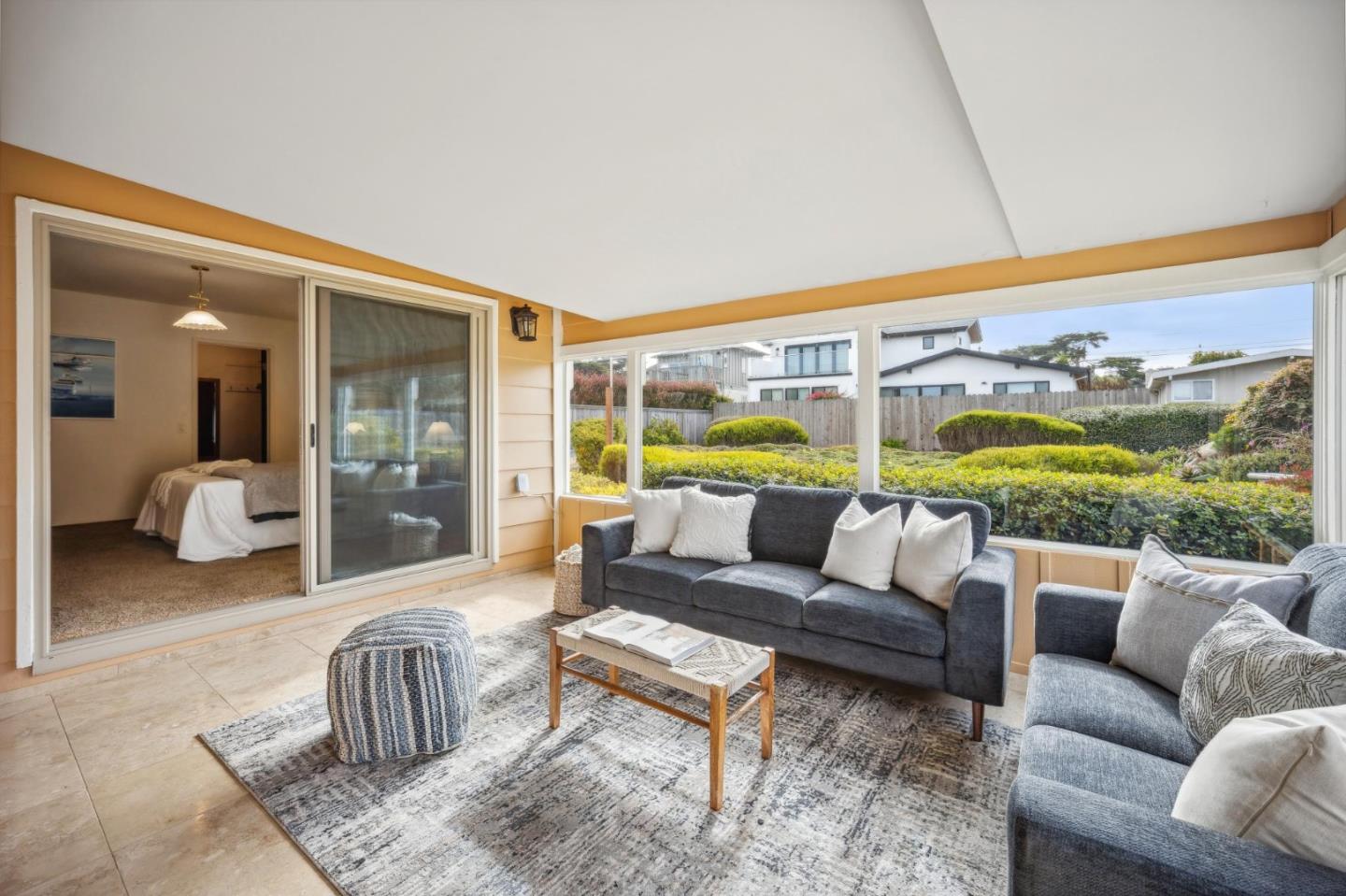 1261 Ocean View Boulevard Pacific Grove, CA 93950 - Photo 27 of 37 a living room with furniture and a large window