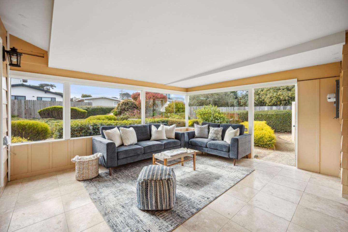 1261 Ocean View Boulevard Pacific Grove, CA 93950 - Photo 28 of 37 a living room with furniture and a large window