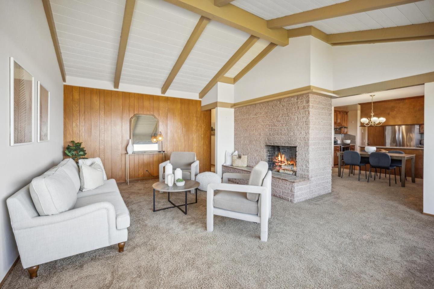 1261 Ocean View Boulevard Pacific Grove, CA 93950 - Photo 8 of 37 a living room with furniture and a fireplace