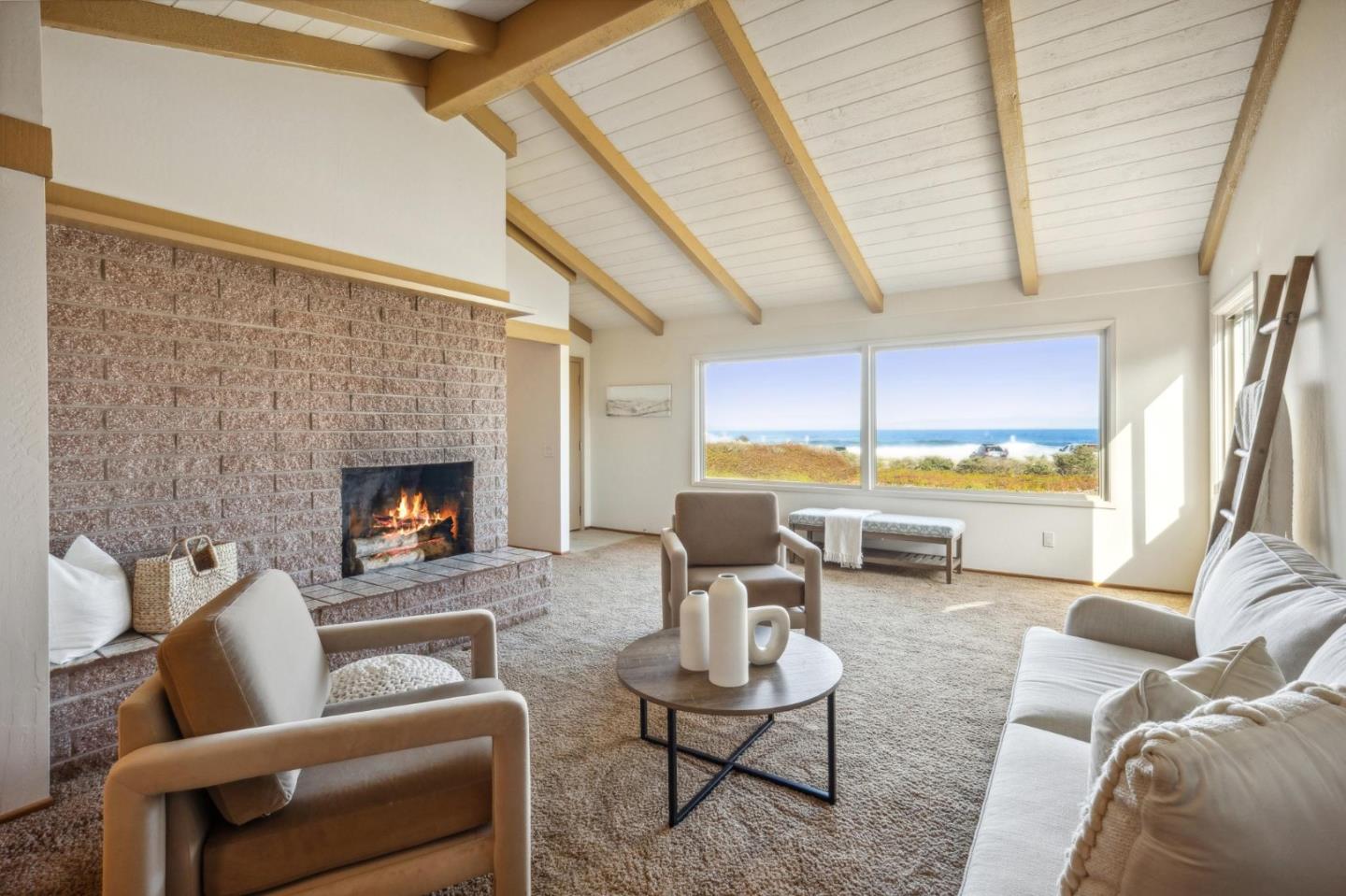 1261 Ocean View Boulevard Pacific Grove, CA 93950 - Photo 9 of 37 a living room with furniture and a fireplace